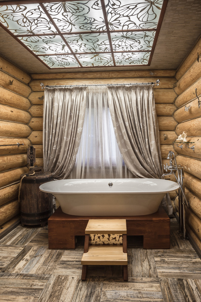 Inspiration for a rustic ceramic tile claw-foot bathtub remodel in Moscow