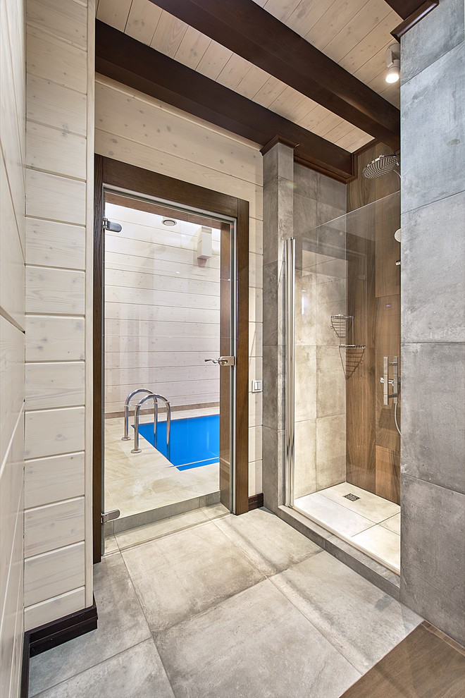 Идея дизайна: ванная комната среднего размера в современном стиле с душем в нише, серой плиткой, керамогранитной плиткой, белыми стенами, полом из керамогранита, душевой кабиной, серым полом и душем с распашными дверями