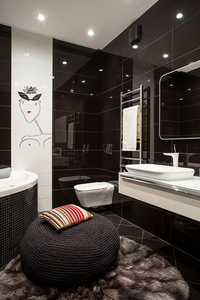 Inspiration for a contemporary ensuite bathroom in Moscow with a corner bath, a wall mounted toilet, white tiles, black tiles, a vessel sink, flat-panel cabinets and white cabinets.