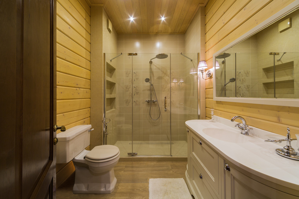 Пример оригинального дизайна: ванная комната среднего размера в скандинавском стиле с бежевыми фасадами, душем в нише, унитазом-моноблоком, бежевыми стенами, полом из керамической плитки, душевой кабиной, монолитной раковиной, столешницей из гранита, бежевым полом, душем с распашными дверями и белой столешницей