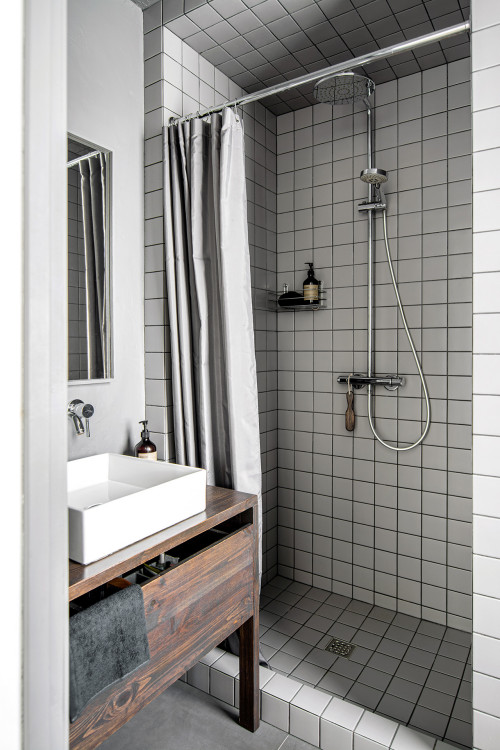 Gray and Gorgeous: Very Small Bathroom Ideas with a Wood Vanity and Gray Square Shower Tiles with Black Grout