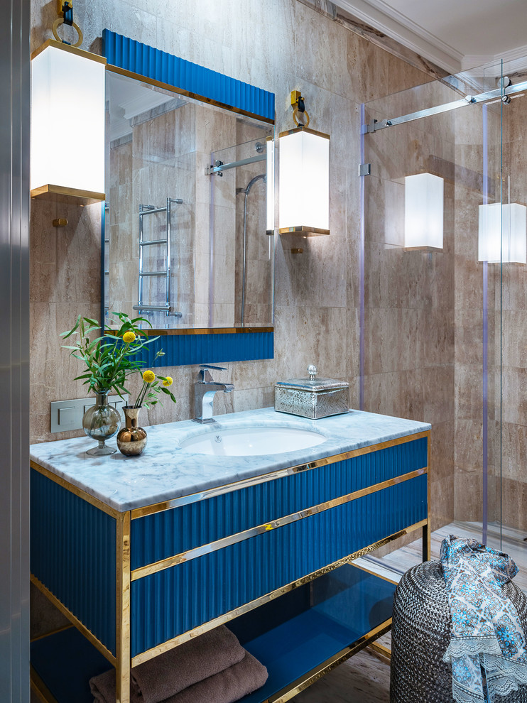 На фото: ванная комната в современном стиле с синими фасадами, душевой кабиной, врезной раковиной, душем с раздвижными дверями, серой столешницей, душем в нише, коричневой плиткой, коричневыми стенами и плоскими фасадами с