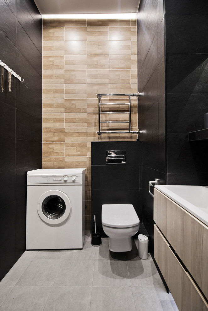 Réalisation d'une salle de bain principale design de taille moyenne avec un carrelage noir.