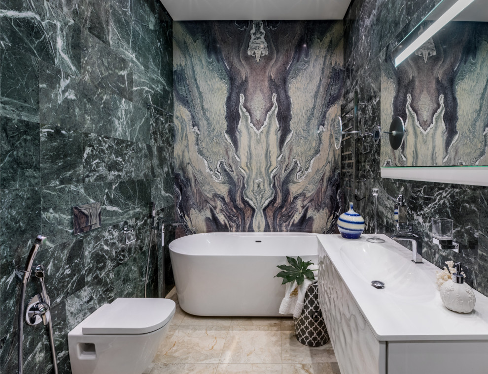 Idee per una stanza da bagno design con ante lisce, ante bianche, vasca freestanding, piastrelle nere, lavabo integrato, pavimento beige e top bianco