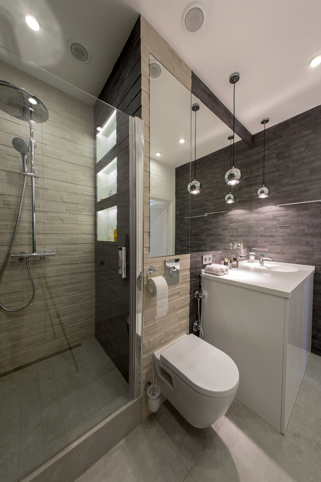 Inspiration for a small contemporary shower room bathroom in Moscow with flat-panel cabinets, white cabinets, an alcove shower, a wall mounted toilet, an integrated sink and multi-coloured walls.