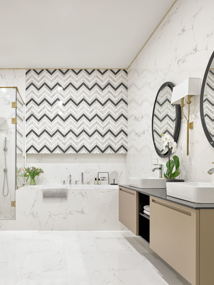 Inspiration for a transitional master white tile and porcelain tile porcelain tile and white floor bathroom remodel in Moscow with flat-panel cabinets, brown cabinets, an undermount tub, a wall-mount toilet, white walls, a drop-in sink and black countertops
