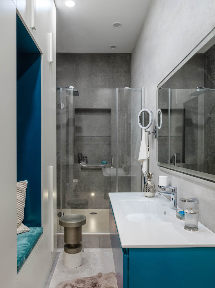 Inspiration for a contemporary shower room bathroom in Moscow with turquoise cabinets, an alcove shower, grey walls, an integrated sink, grey floors, a hinged door and white worktops.