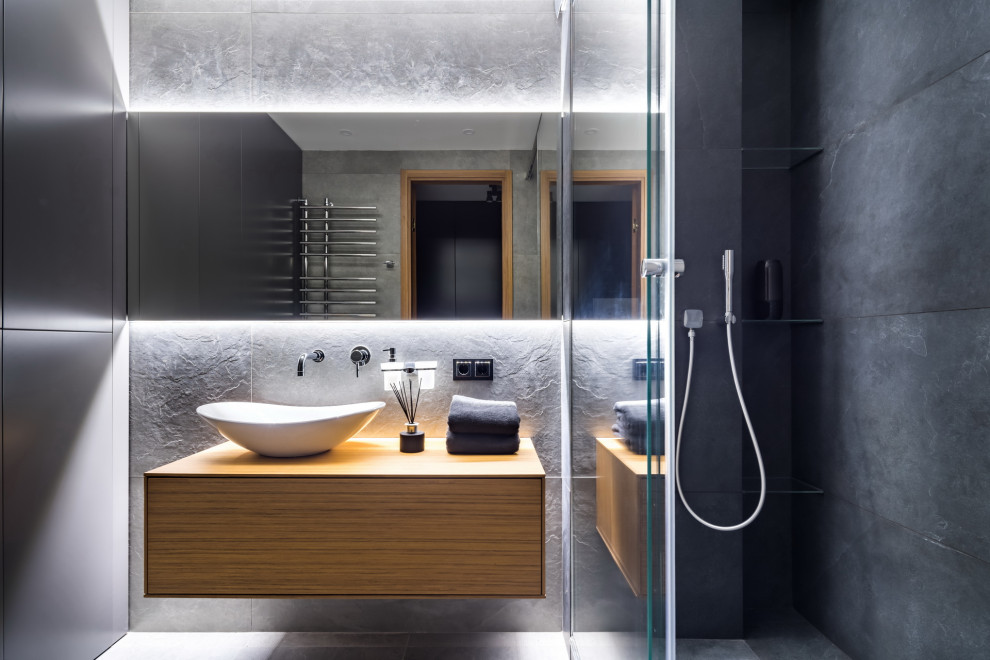 Inspiration for a small contemporary bathroom in Moscow with flat-panel cabinets, medium wood cabinets, a walk-in shower, grey tiles, a vessel sink, wooden worktops, grey floors, an open shower, brown worktops, a single sink and a floating vanity unit.