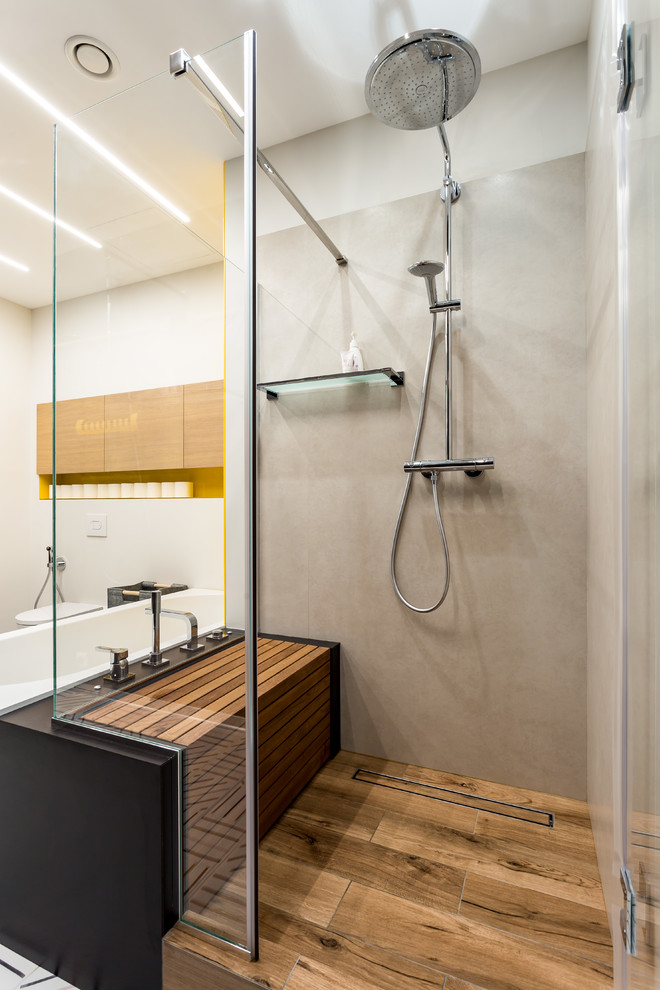 Photo of a medium sized contemporary shower room bathroom in Saint Petersburg with open cabinets, black cabinets, a freestanding bath, a corner shower, a wall mounted toilet, beige walls, ceramic flooring, a built-in sink, wooden worktops, multi-coloured floors, a hinged door and beige worktops.
