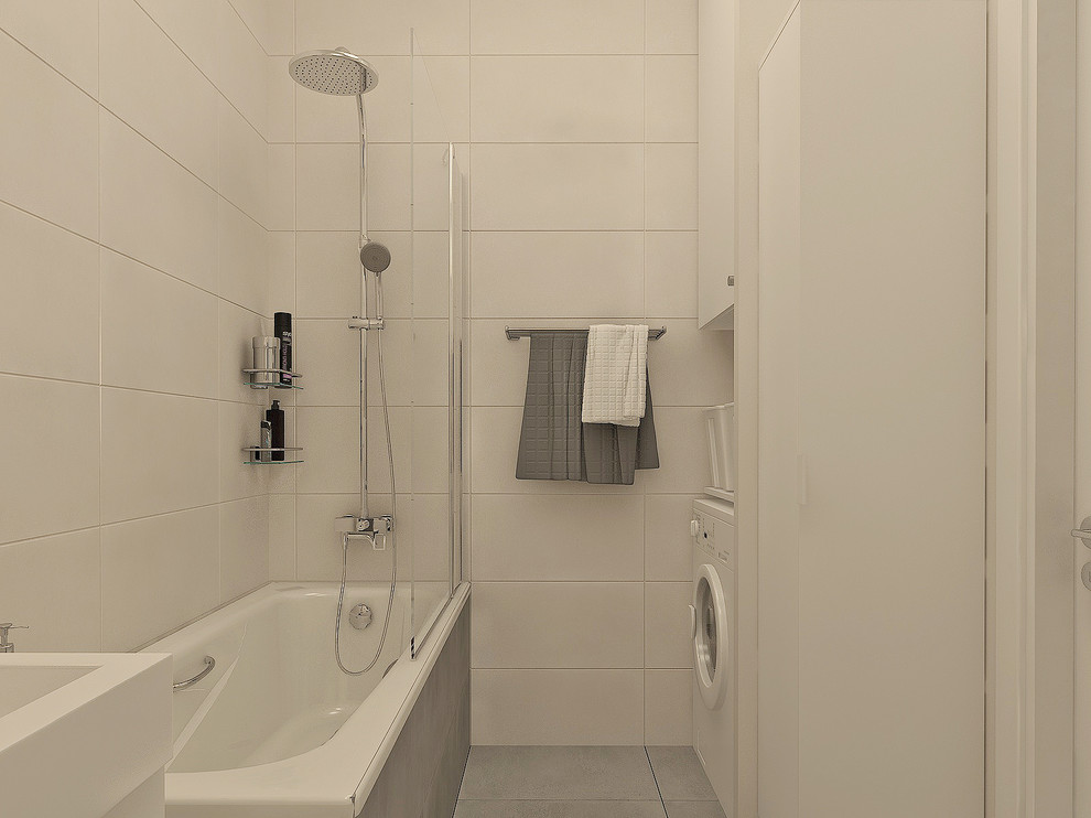Design ideas for a medium sized scandi ensuite bathroom in Other with flat-panel cabinets, white cabinets, a shower/bath combination, a wall mounted toilet, beige tiles, porcelain tiles, beige walls, porcelain flooring, a built-in sink, grey floors and a shower curtain.