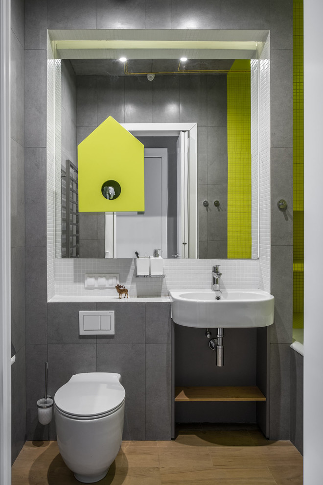 Inspiration for a small contemporary ensuite bathroom in Moscow with an alcove bath, a shower/bath combination, a two-piece toilet, white tiles, green tiles, grey tiles, mosaic tiles, a wall-mounted sink and brown floors.