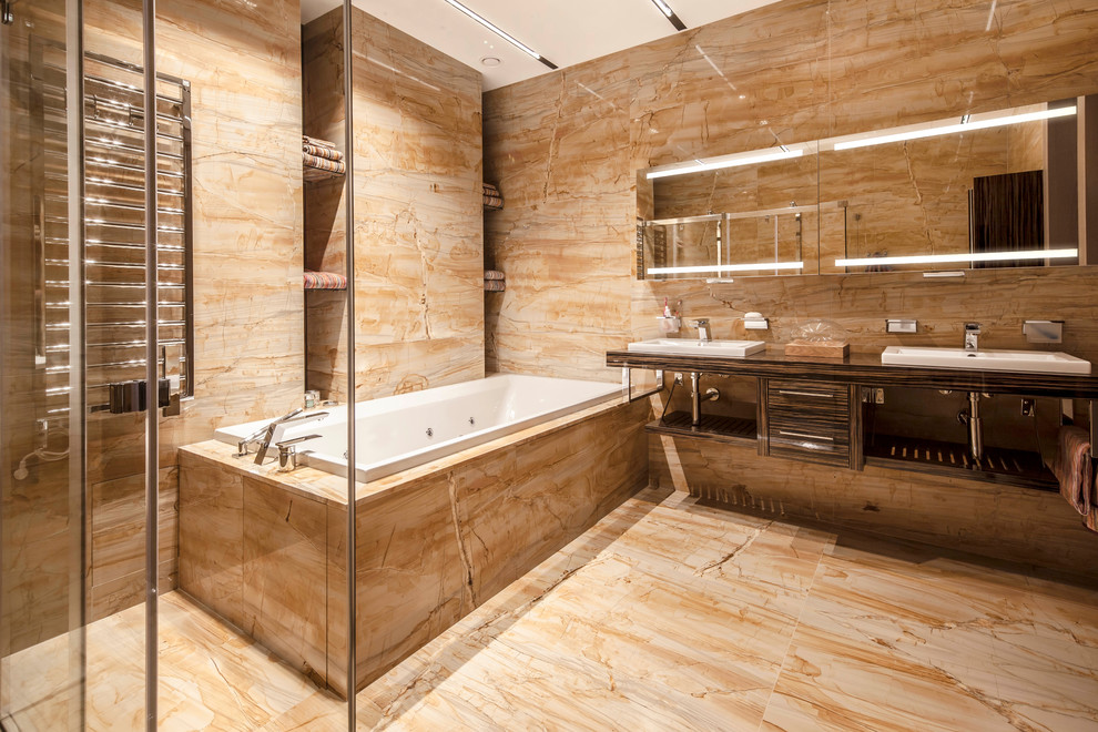 Example of a small trendy gray tile and stone slab marble floor bathroom design in Moscow with flat-panel cabinets, brown cabinets, a wall-mount toilet, gray walls, a pedestal sink and solid surface countertops