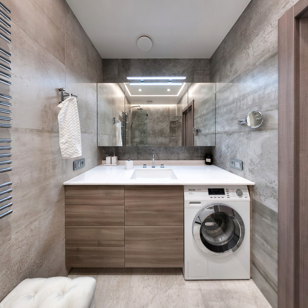Mid-sized trendy master beige tile and porcelain tile porcelain tile bathroom photo in Saint Petersburg with flat-panel cabinets, medium tone wood cabinets, an undermount sink, solid surface countertops, a hinged shower door and white countertops