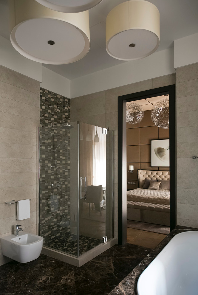 На фото: большая главная ванная комната в современном стиле с накладной ванной, угловым душем, каменной плиткой, бежевыми стенами, мраморным полом и биде