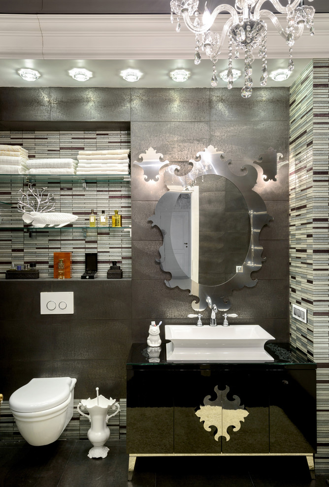 Foto de cuarto de baño ecléctico con sanitario de pared y lavabo sobreencimera