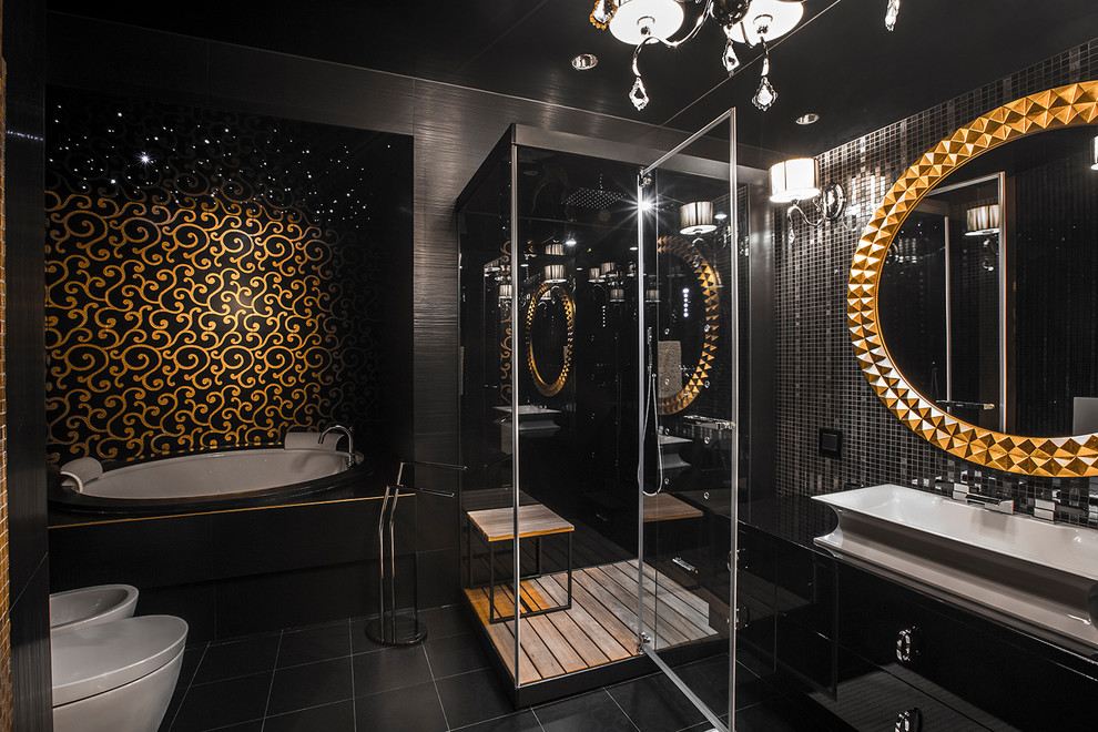 Inspiration pour une salle de bain principale design avec un placard à porte plane, des portes de placard noires, une baignoire posée, un carrelage noir, mosaïque, une vasque, un sol noir et une cabine de douche à porte battante.