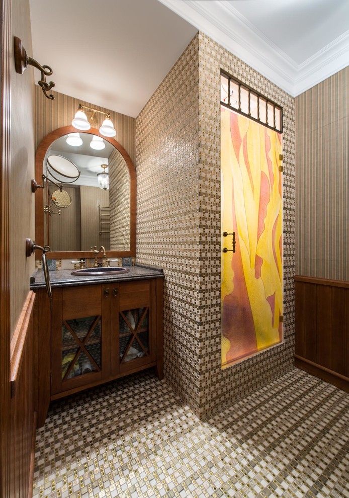 Design ideas for a traditional shower room bathroom in Moscow with beige tiles, marble worktops, dark wood cabinets, an alcove shower, a built-in sink, multi-coloured walls, a hinged door and glass-front cabinets.