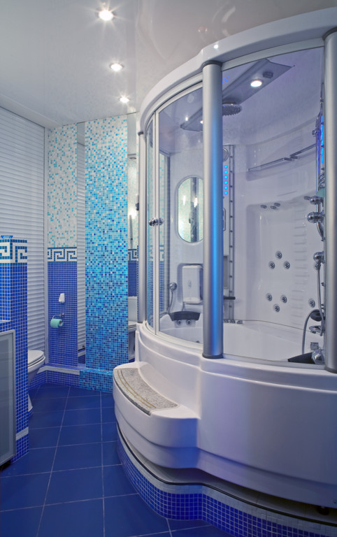 Large contemporary ensuite bathroom in Moscow with a hot tub, a shower/bath combination, blue tiles, porcelain tiles, porcelain flooring and a two-piece toilet.