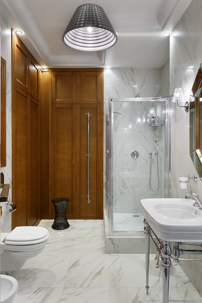 This is an example of a traditional shower room bathroom in Saint Petersburg with a claw-foot bath, white tiles, a console sink, white floors, a corner shower, a wall mounted toilet and a hinged door.