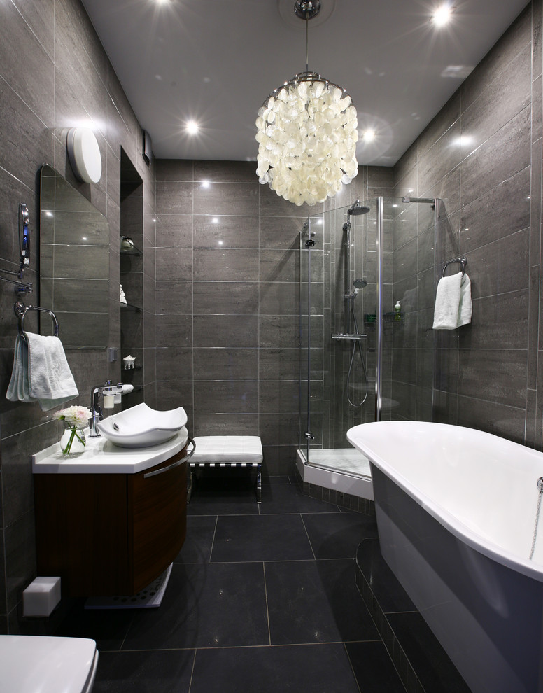 This is an example of a medium sized contemporary ensuite bathroom in Moscow with a freestanding bath, a corner shower, grey tiles, porcelain tiles, porcelain flooring and a vessel sink.