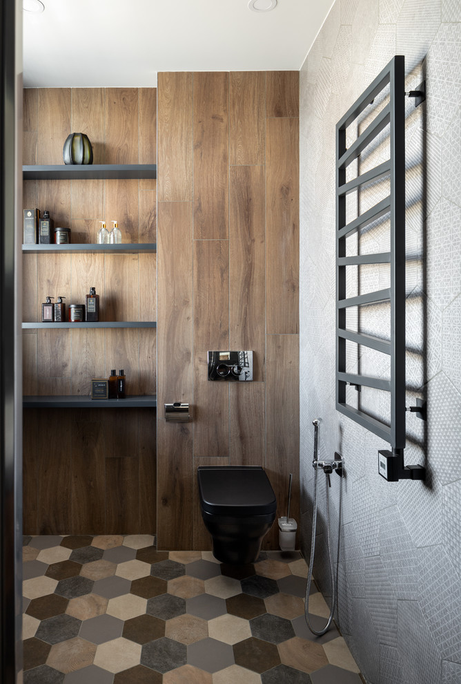 Design ideas for a large contemporary shower room bathroom in Moscow with dark wood cabinets, a wall mounted toilet, black tiles, ceramic tiles, grey walls, ceramic flooring, a built-in sink, solid surface worktops, multi-coloured floors, grey worktops and open cabinets.