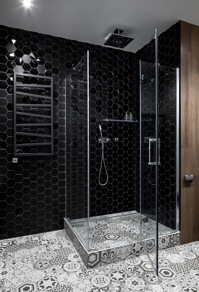 Large contemporary ensuite bathroom in Moscow with flat-panel cabinets, dark wood cabinets, a submerged bath, a corner shower, a wall mounted toilet, black tiles, mosaic tiles, grey walls, ceramic flooring, a built-in sink, solid surface worktops, white floors, a sliding door and grey worktops.