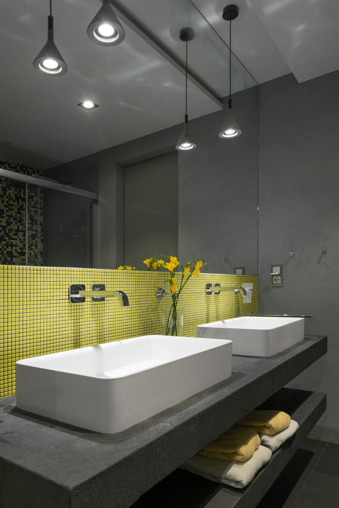 Photo of a contemporary bathroom in Moscow with yellow tiles, mosaic tiles, a vessel sink and grey worktops.