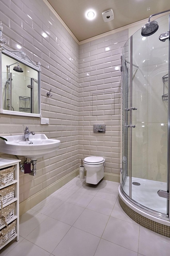 Immagine di una stanza da bagno con doccia contemporanea con doccia ad angolo, WC sospeso, piastrelle diamantate, lavabo sospeso e piastrelle beige