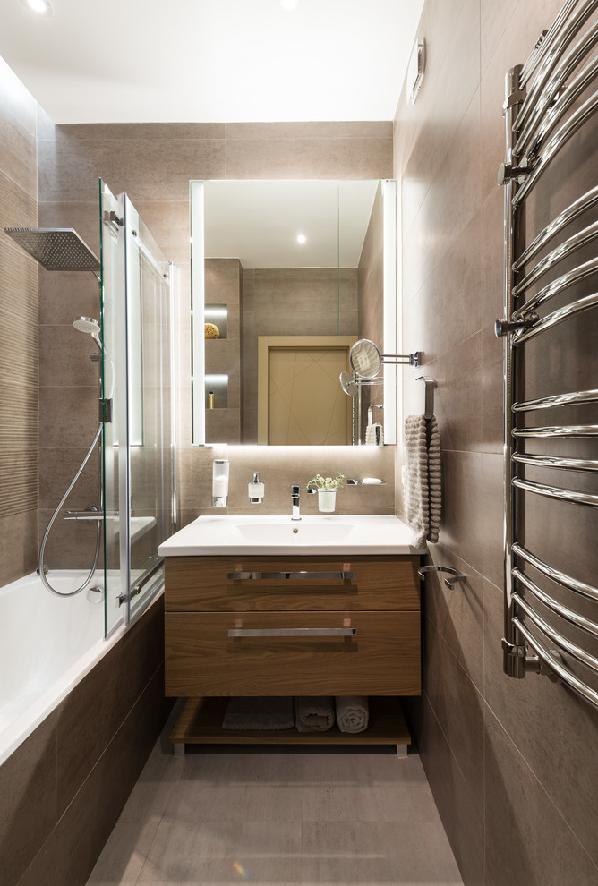 Medium sized contemporary ensuite bathroom in Moscow with flat-panel cabinets, medium wood cabinets, an alcove bath, a shower/bath combination, brown tiles, porcelain tiles, brown walls, porcelain flooring, an integrated sink, solid surface worktops, brown floors, a sliding door, white worktops, a single sink, a floating vanity unit and a drop ceiling.