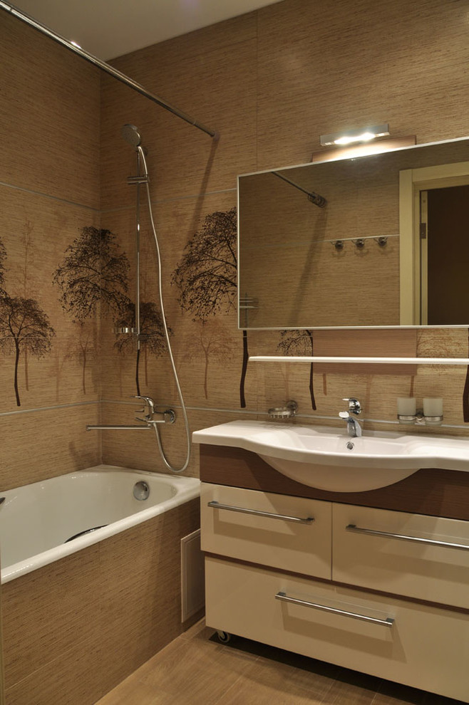 Inspiration pour une salle de bain design avec une baignoire en alcôve, un combiné douche/baignoire et un lavabo intégré.