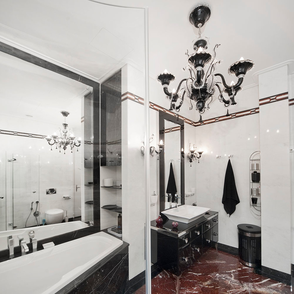 На фото: главная ванная комната среднего размера в классическом стиле с плоскими фасадами, черными фасадами, ванной в нише, угловым душем, инсталляцией, белой плиткой, мраморной плиткой, белыми стенами, мраморным полом, настольной раковиной, стеклянной столешницей, красным полом и душем с раздвижными дверями с