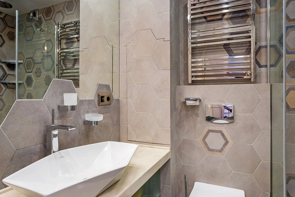 This is an example of a small contemporary shower room bathroom in Moscow with glass-front cabinets, green cabinets, a corner shower, a wall mounted toilet, grey tiles, porcelain tiles, multi-coloured walls, porcelain flooring, a vessel sink, solid surface worktops, grey floors, a hinged door and beige worktops.