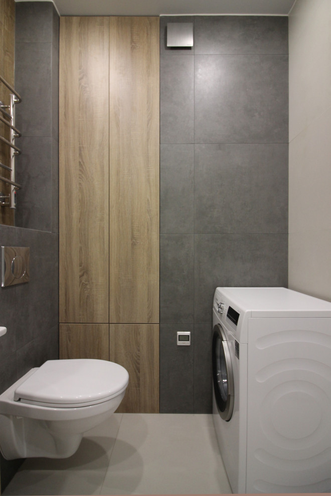 Small danish gray tile and porcelain tile porcelain tile and gray floor tub/shower combo photo in Saint Petersburg with flat-panel cabinets, white cabinets, an undermount tub, a wall-mount toilet, gray walls, a drop-in sink, a hinged shower door and white countertops