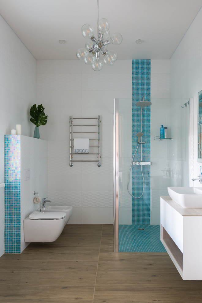 Inspiration for a mid-sized transitional 3/4 white tile and ceramic tile porcelain tile, beige floor and single-sink bathroom remodel in Other with flat-panel cabinets, white cabinets, a bidet, white walls, a drop-in sink, solid surface countertops, beige countertops and a floating vanity