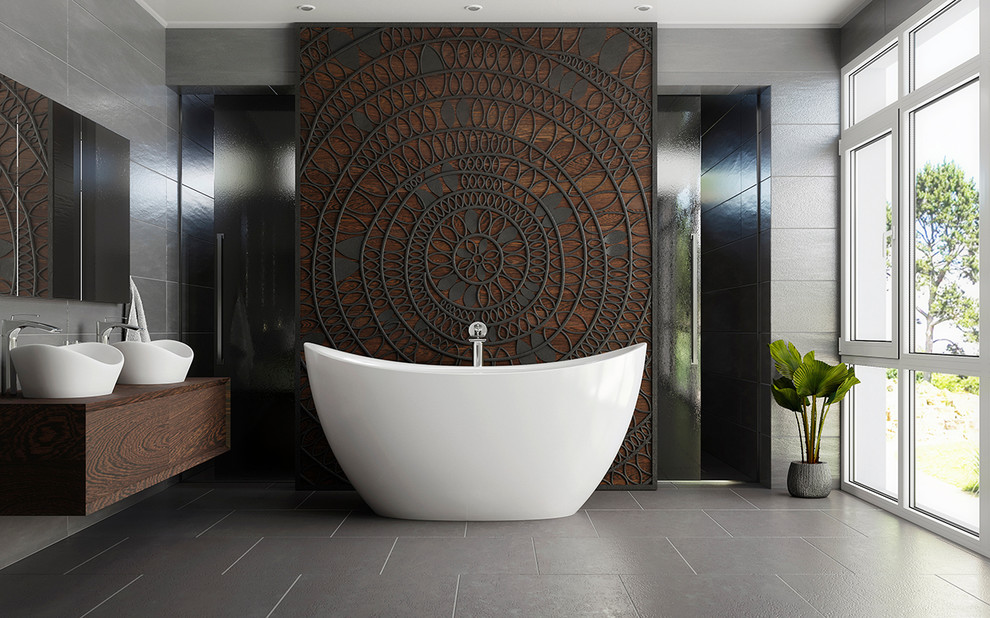 Inspiration pour une petite salle de bain principale design avec une baignoire indépendante, un carrelage gris, un lavabo posé et un sol gris.