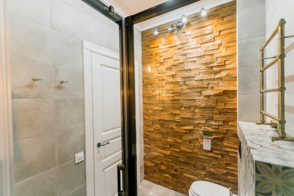 Medium sized mediterranean shower room bathroom in Moscow with a corner shower, a wall mounted toilet, grey tiles, porcelain tiles, grey walls, porcelain flooring, a vessel sink, wooden worktops, grey floors and a sliding door.