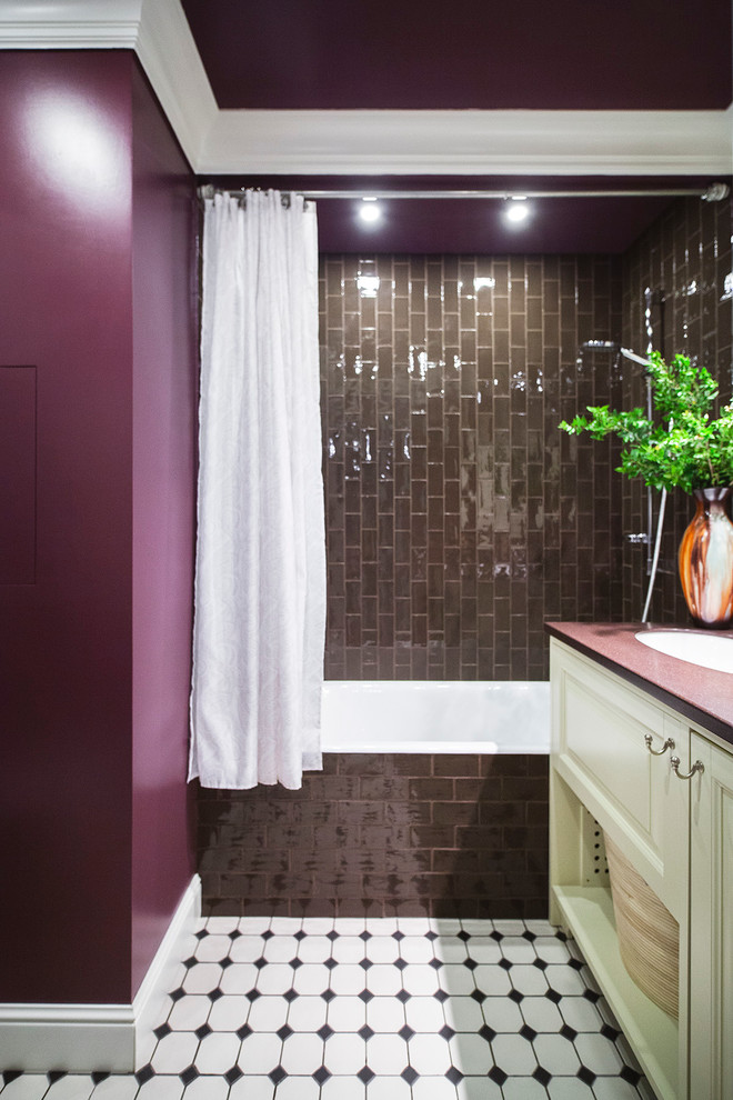 Photo of a traditional bathroom in Moscow with an alcove bath, brown tiles, purple walls and a submerged sink.