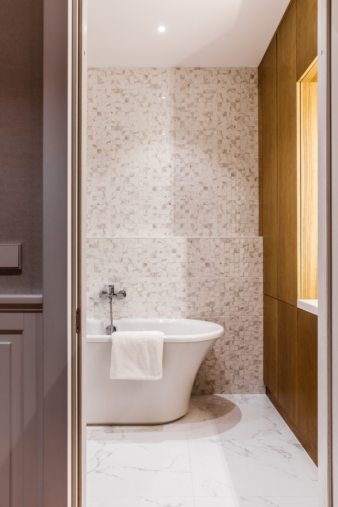 Inspiration for a large contemporary family bathroom in Moscow with flat-panel cabinets, brown cabinets, a bidet, beige tiles, ceramic tiles, beige walls, ceramic flooring, a submerged sink, solid surface worktops, white floors, white worktops and a freestanding bath.