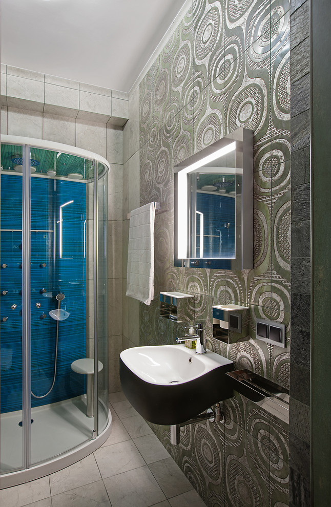 This is an example of a medium sized contemporary shower room bathroom in Moscow with a built-in shower, a wall mounted toilet, multi-coloured tiles, stone tiles, multi-coloured walls, marble flooring and a wall-mounted sink.