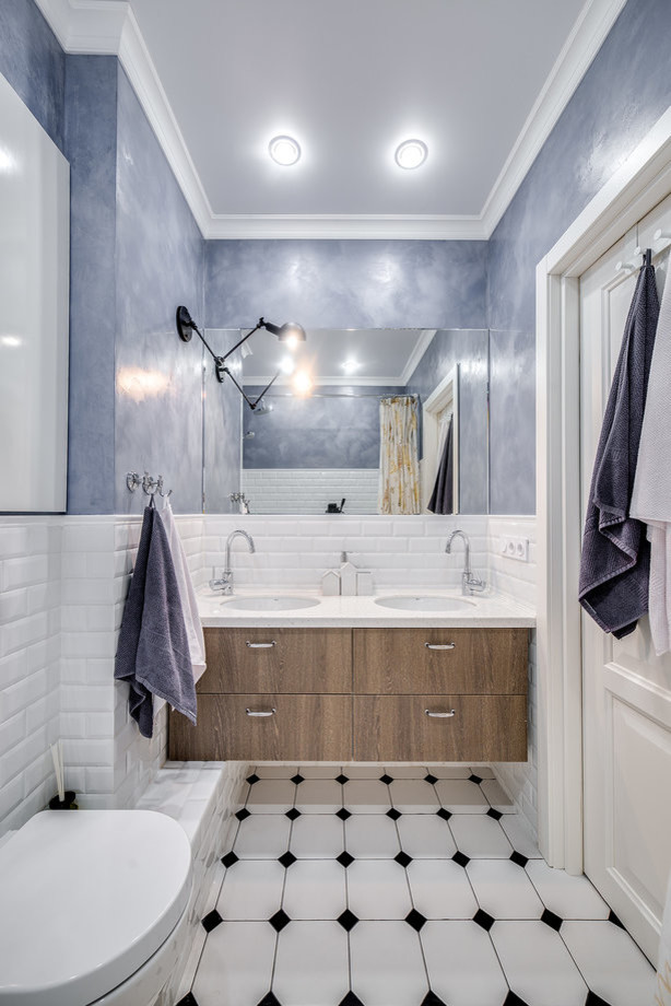 Small danish kids' white tile and ceramic tile ceramic tile and white floor bathroom photo in Saint Petersburg with flat-panel cabinets, light wood cabinets, an undermount tub, a wall-mount toilet, white walls, an undermount sink, solid surface countertops and beige countertops