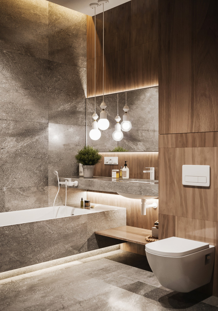 Пример оригинального дизайна: ванная комната среднего размера в современном стиле с полновстраиваемой ванной, душем в нише, инсталляцией, серой плиткой, керамогранитной плиткой, серыми стенами, полом из керамогранита, душевой кабиной, врезной раковиной, столешницей из плитки, серым полом и серой столешницей