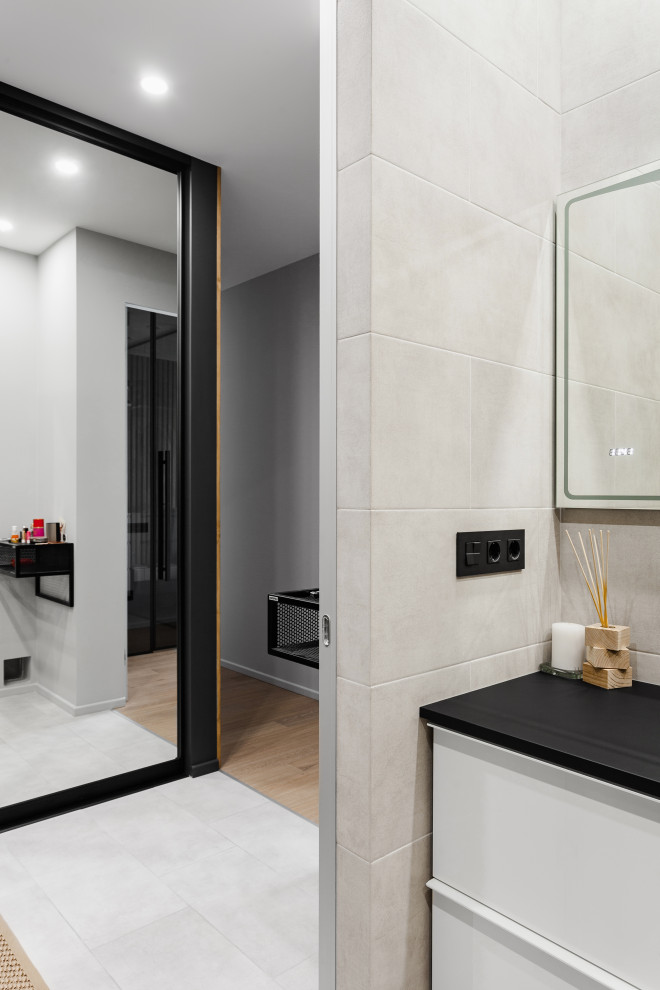 Example of a mid-sized trendy master gray tile and wood-look tile porcelain tile, gray floor and single-sink wet room design in Moscow with flat-panel cabinets, white cabinets, a wall-mount toilet, black walls, a vessel sink, solid surface countertops, a hinged shower door, black countertops, a niche and a floating vanity