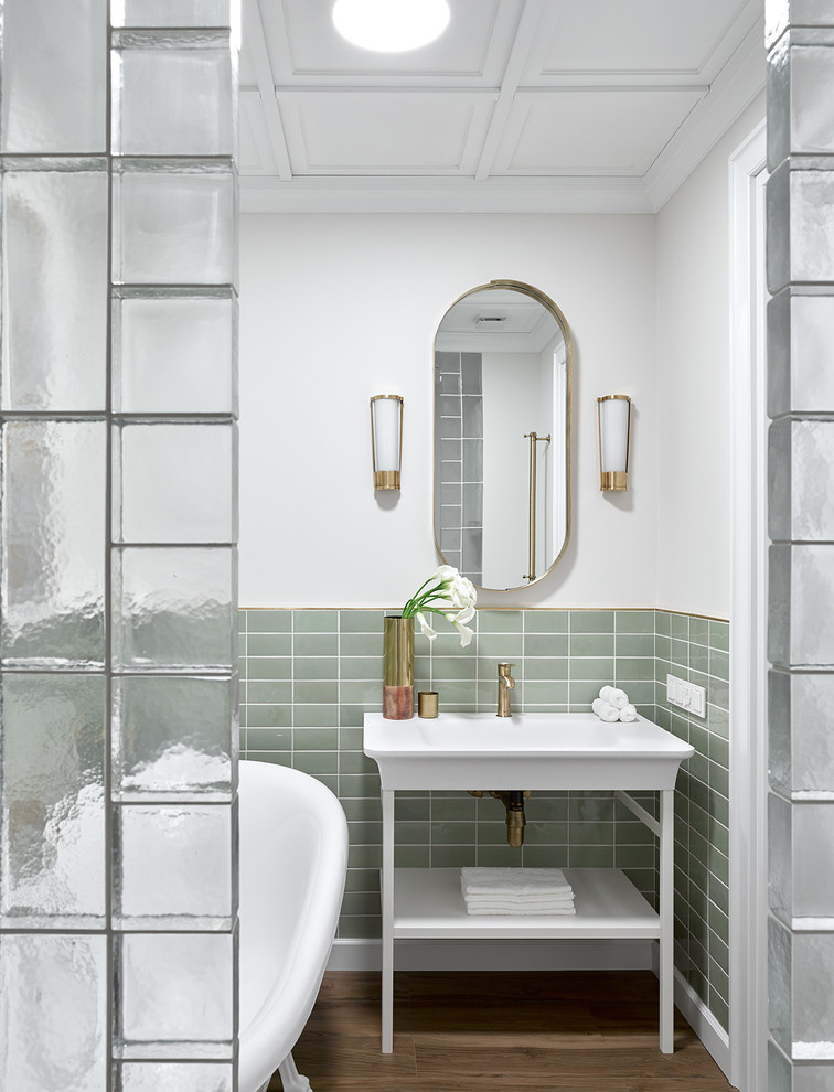 Inspiration for a transitional master green tile brown floor claw-foot bathtub remodel in Moscow with open cabinets, white walls and a console sink