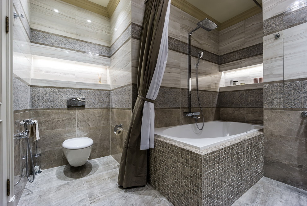 Inspiration för mellanstora klassiska badrum, med en vägghängd toalettstol, grå kakel, porslinskakel, klinkergolv i porslin och ett hörnbadkar