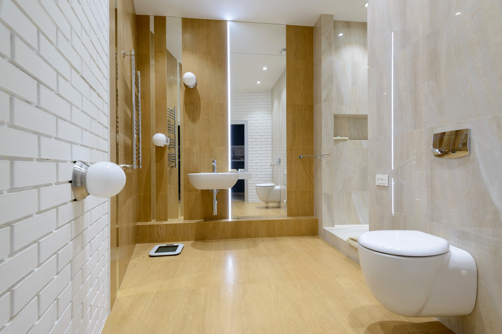 Inspiration pour une salle de bain design avec WC suspendus et un lavabo suspendu.