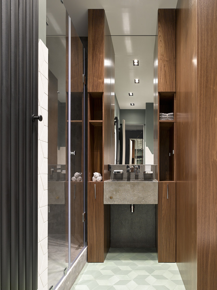 Photo of a contemporary shower room bathroom in Other with flat-panel cabinets, medium wood cabinets, an alcove shower, an integrated sink, white floors and a hinged door.