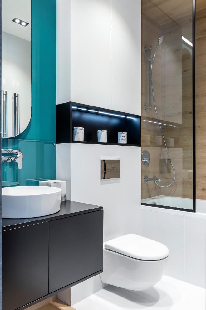 Example of a mid-sized trendy beige tile and porcelain tile porcelain tile and white floor bathroom design in Moscow with flat-panel cabinets, gray cabinets, a wall-mount toilet, blue walls, a vessel sink and gray countertops