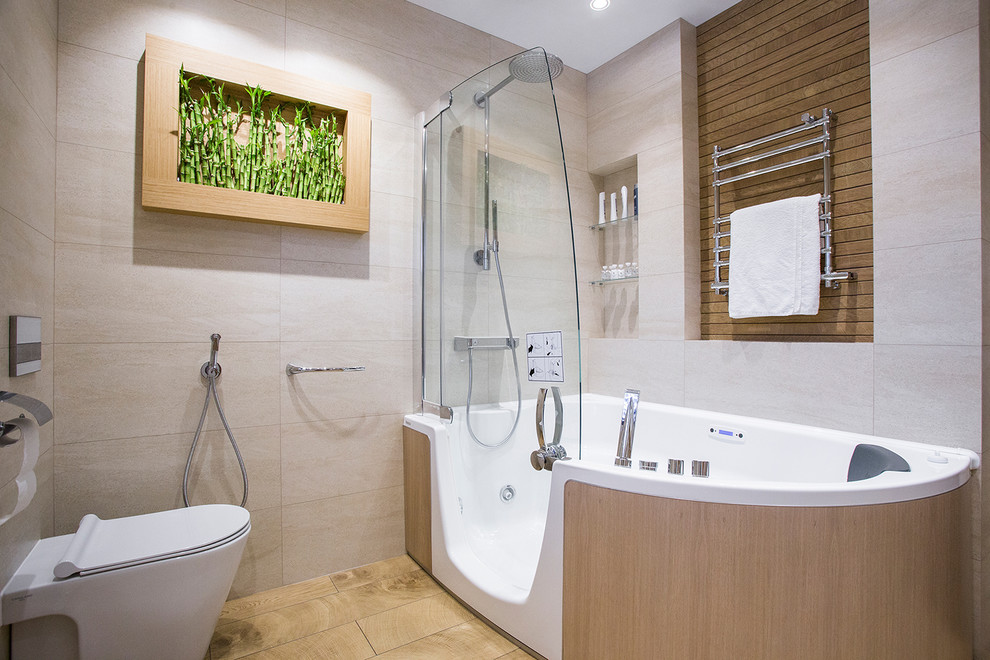 Mid-sized trendy master beige tile bathroom photo in Moscow with a hot tub and a two-piece toilet