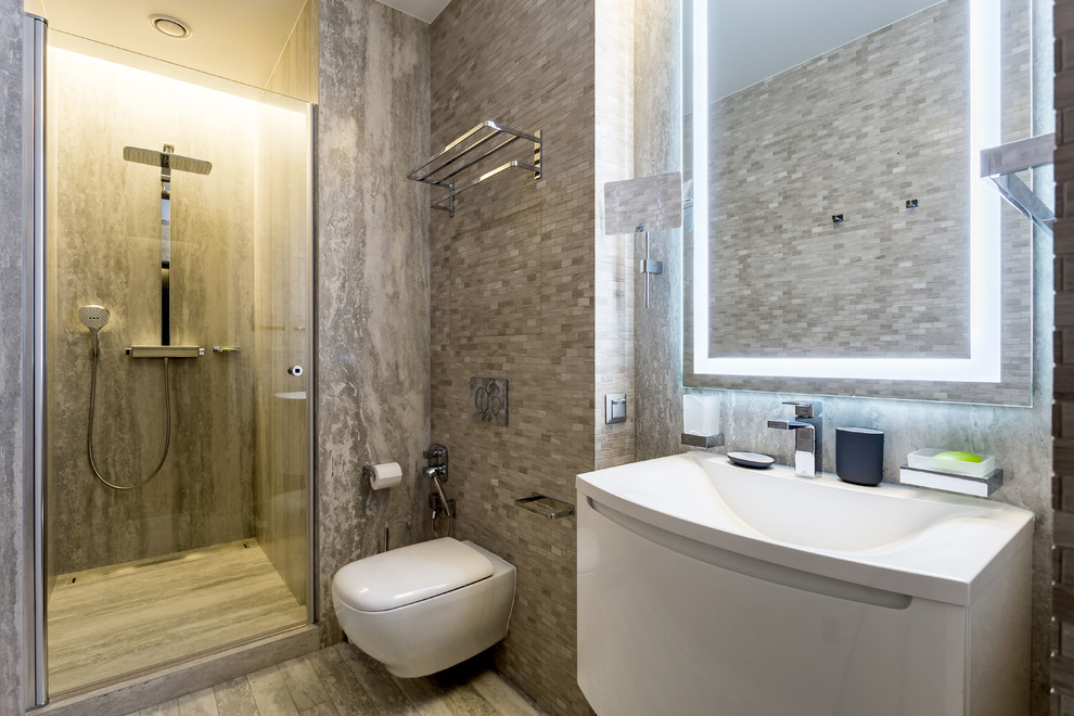 Bathroom - mid-sized contemporary 3/4 brown tile and ceramic tile porcelain tile and brown floor bathroom idea in Saint Petersburg with flat-panel cabinets, gray cabinets, a bidet, brown walls, a drop-in sink, solid surface countertops and gray countertops