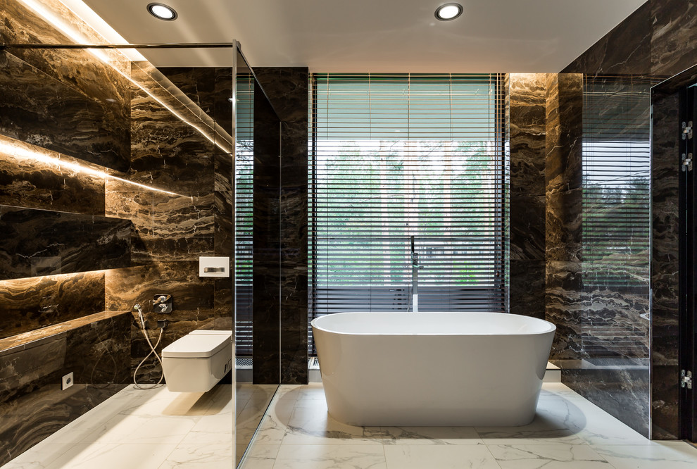 This is an example of a large contemporary ensuite bathroom in Saint Petersburg with flat-panel cabinets, grey cabinets, a hot tub, brown tiles, ceramic tiles, white walls, porcelain flooring, a built-in sink, solid surface worktops, white floors, an open shower and white worktops.